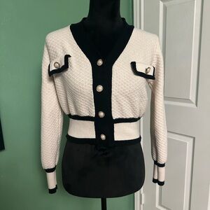 Black and cream cardigan with faux pearl buttons